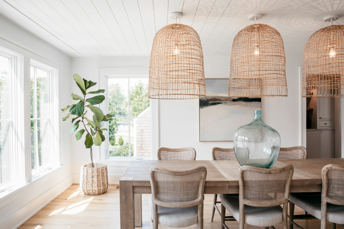 wicker lamps and bright light in a dining room with modern, clean designed windows