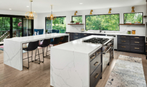 A large white island in a bright, modern kitchen