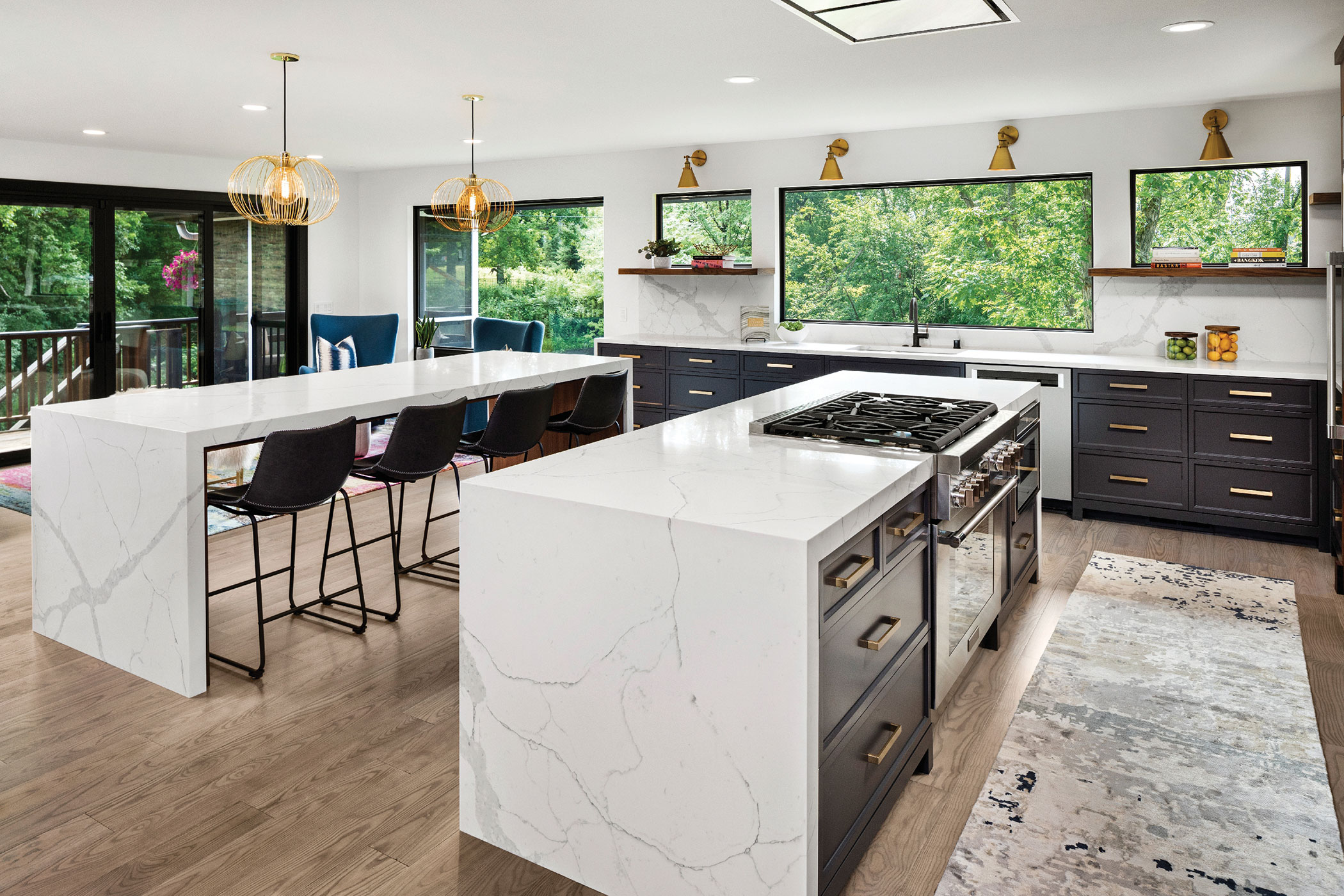 A large white island in a bright, modern kitchen