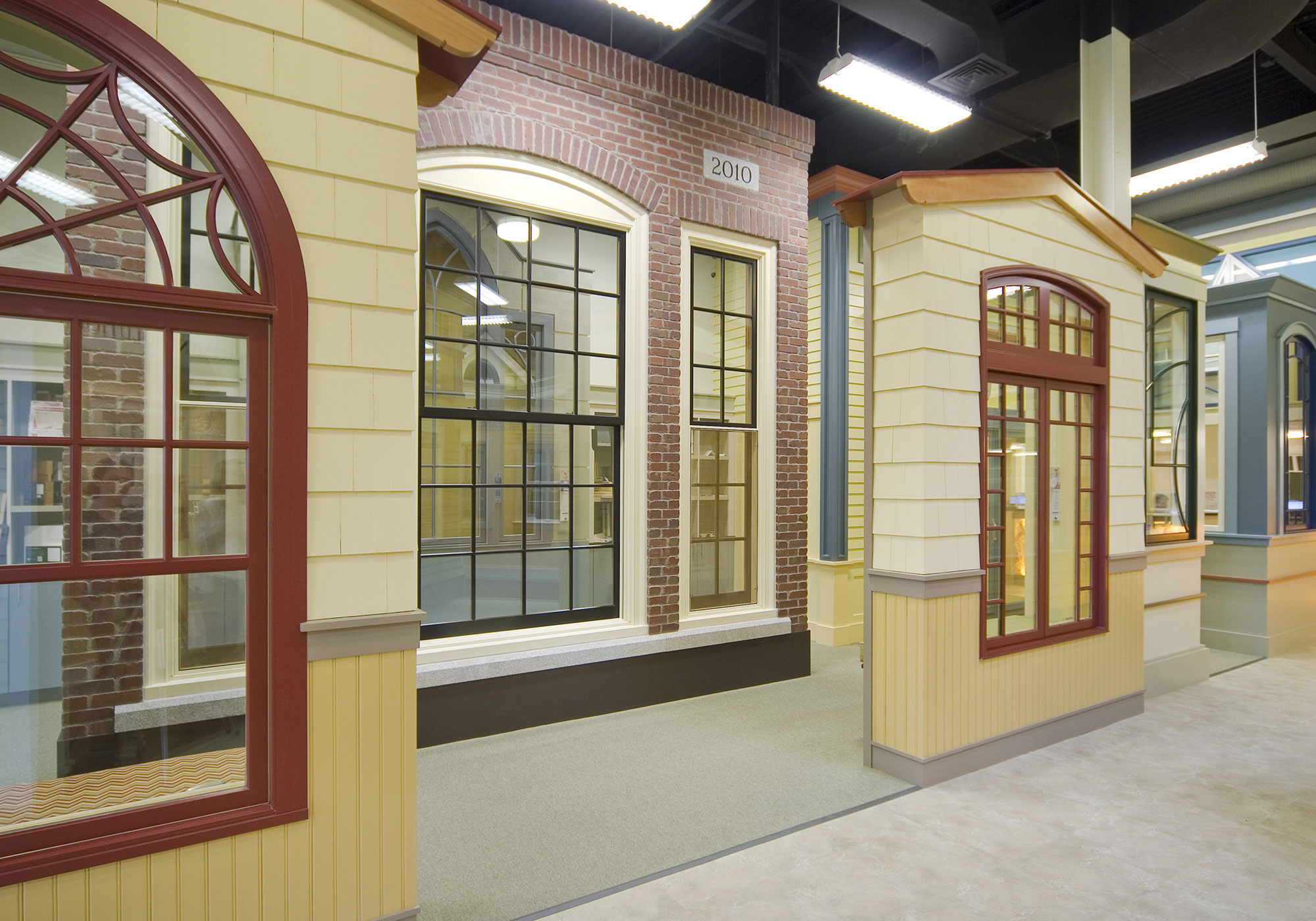 A historic, arched window display in the Marvin Design Gallery showroom
