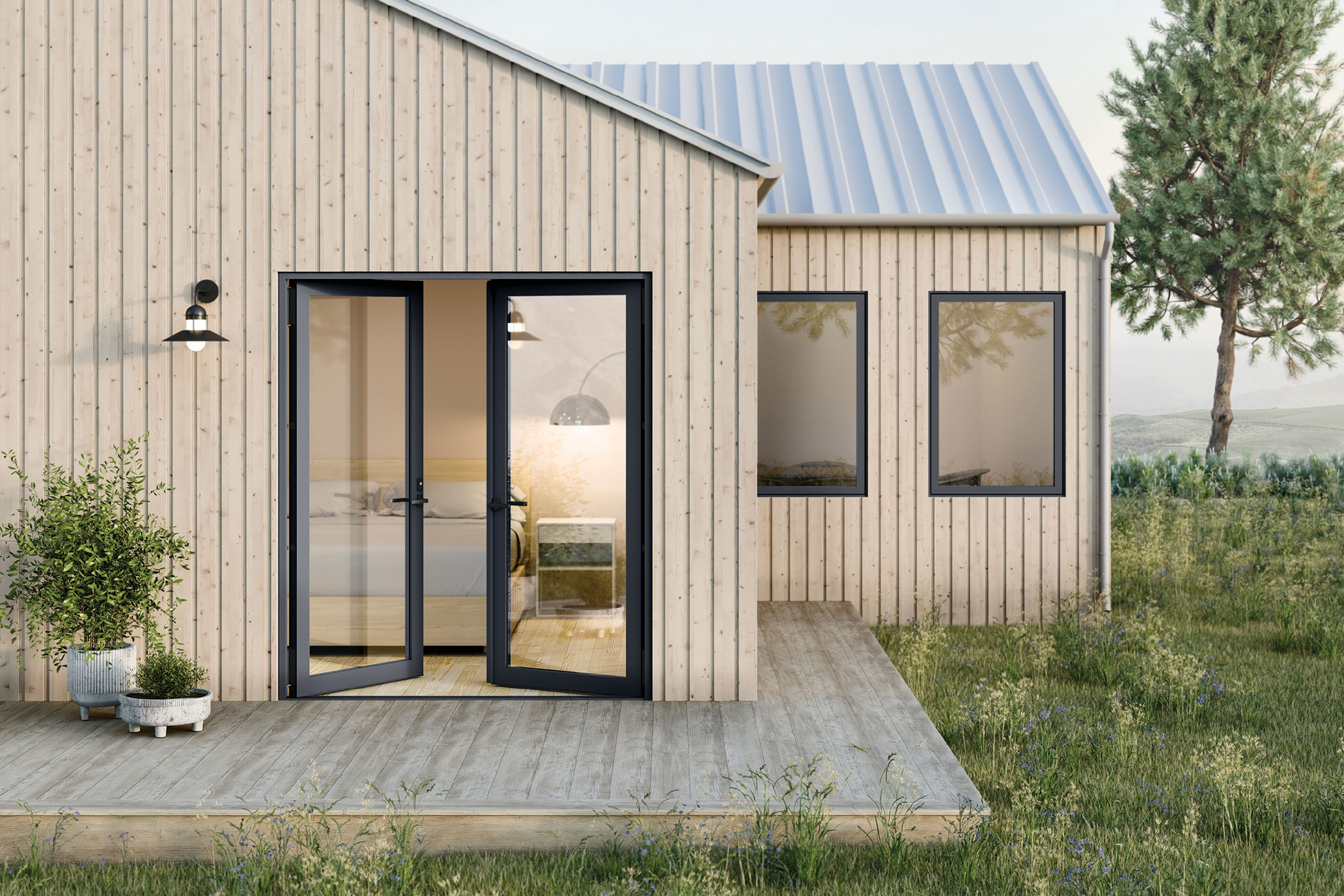 An ajar, full height glass door on the front of a simple, modern home.