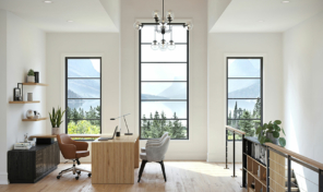 three large windows shine light on a cozy sitting room