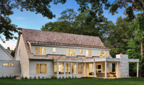 A farmhouse with new white clad windows