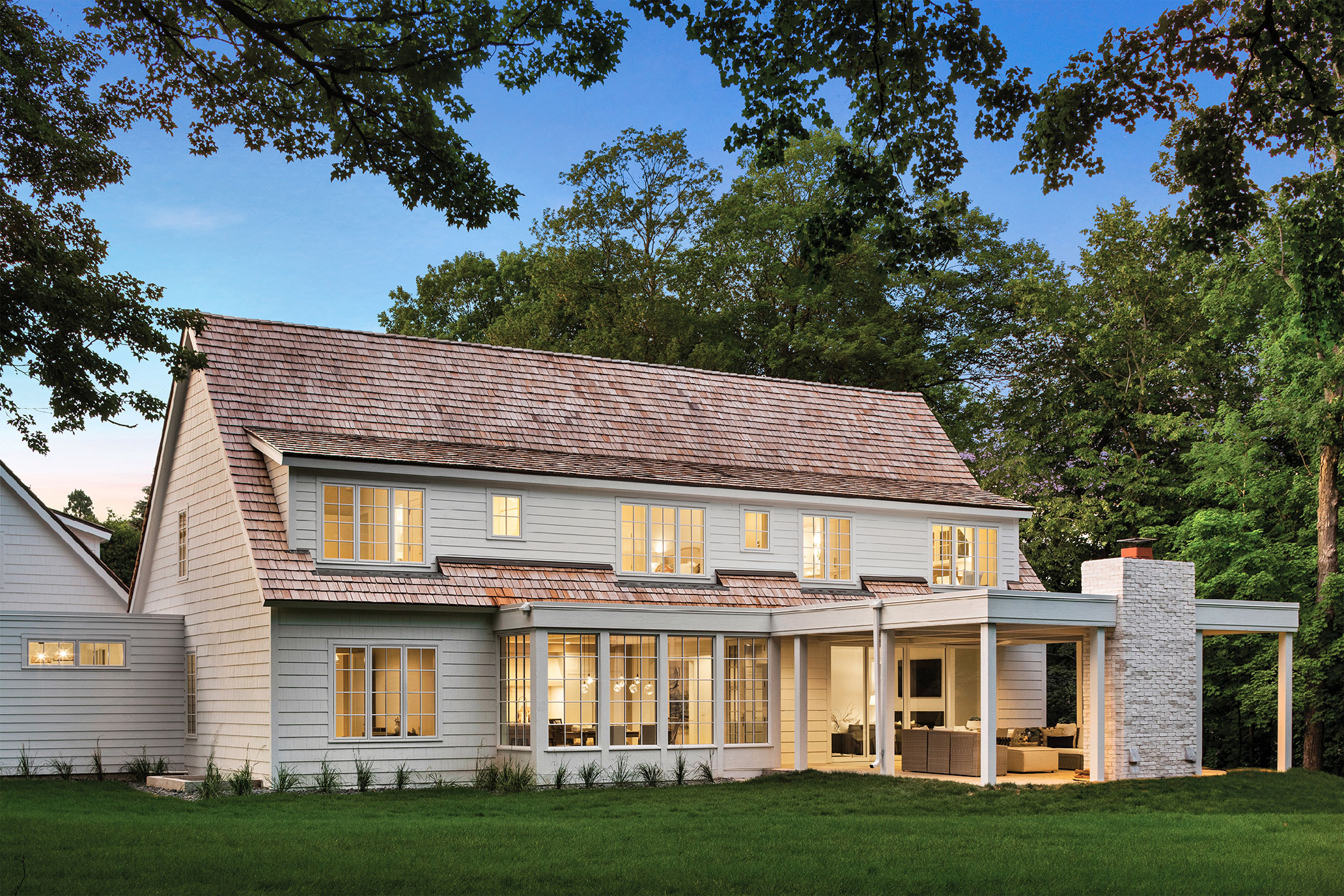 A farmhouse with new white clad windows