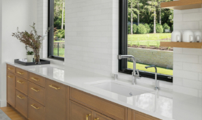 Beige cabinets, and white countertops in a modern and clean bathroom