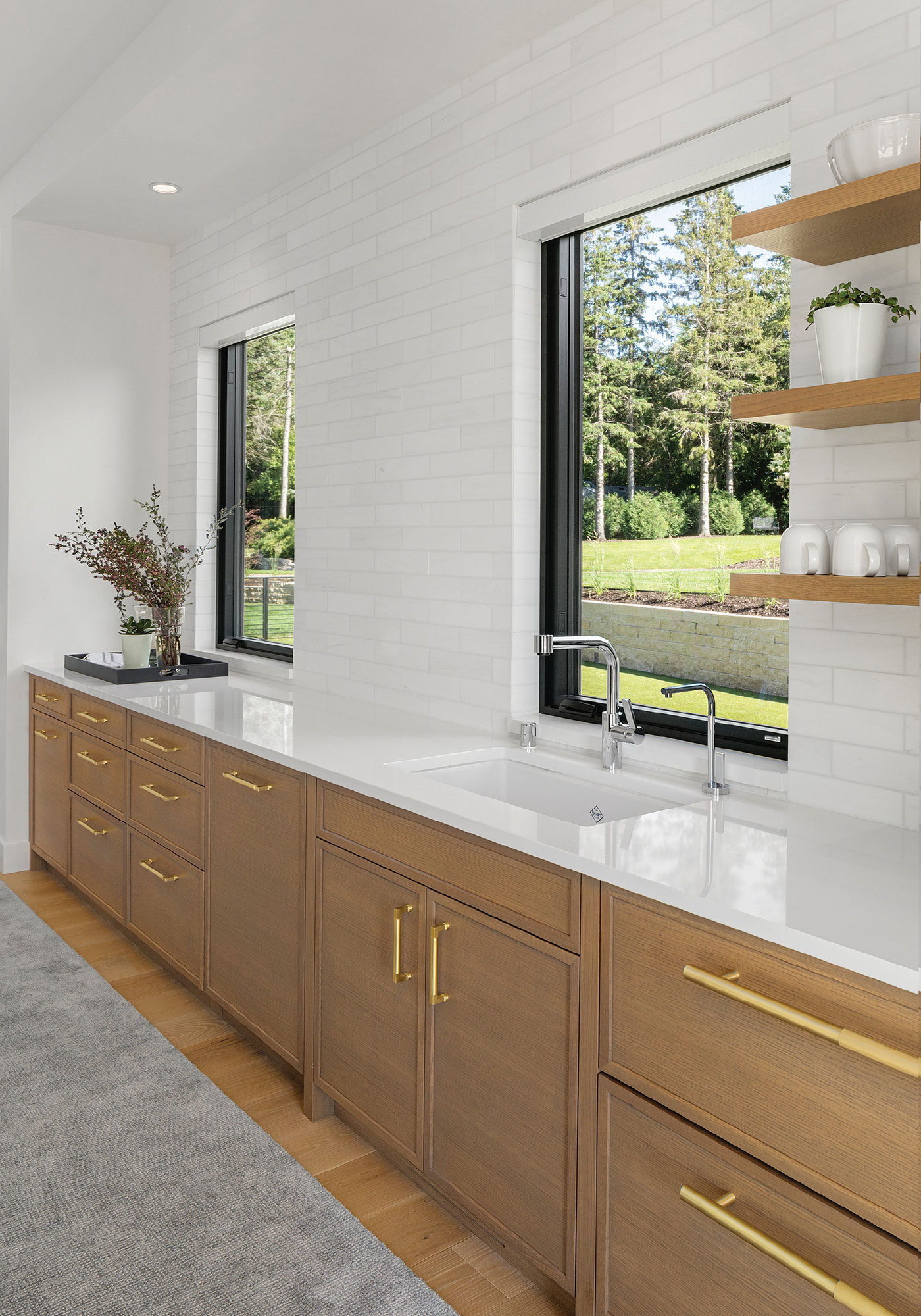 Beige cabinets, and white countertops in a modern and clean bathroom
